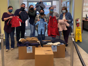 staff members with give a kid a coat
