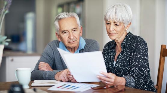 Older couple reviewing papers