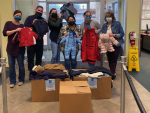 staff members with give a kid a coat