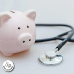 piggy bank with stethoscope